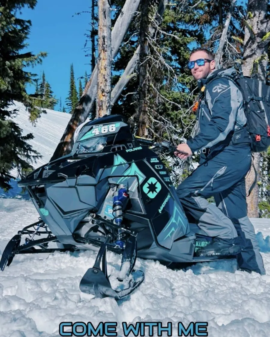 Walter Kenzie with his sled in the trees near Seeley Lake